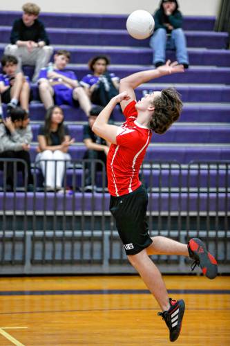 Athol’s Logan McGrath serves against Holyoke in the second set Friday in Holyoke.