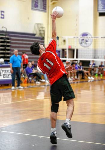 Athol’s Colin Mason (11) serves against Holyoke in the second set Friday in Holyoke.