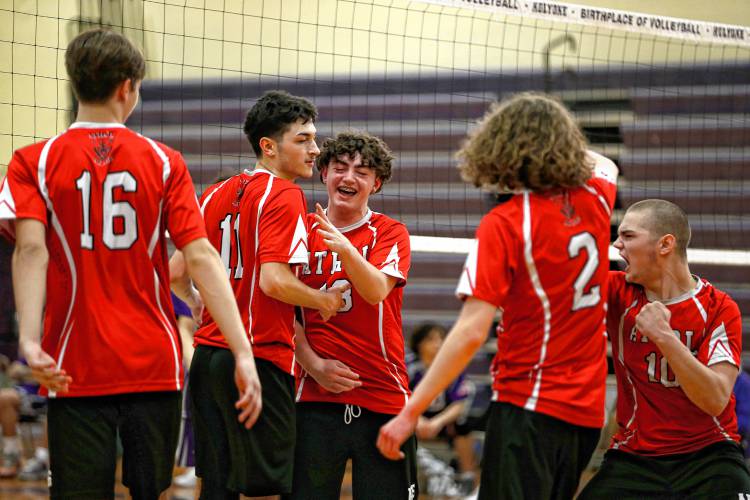 Athol players celebrate a point against Holyoke in the third set Friday in Holyoke.