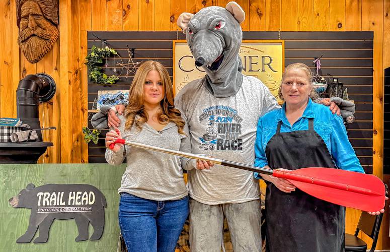 Paddles, the mascot for the Athol to Orange River Rat Race, visited (from left) Stephanie Cook and Terry Bouchard at Trailhead and the Corner Cafe in Orange. Trailhead is one of two locations selling River Rat Race T-shirts and sweatshirts. Else Where in Athol is the other location to buy official 2024 River Rat shirts. The River Rat Race is on Saturday, April 13 at 1 p.m. Sign-ups can be done at www.RiverRatRace.com or in person at Else Where at 1485 Main St. in Athol. Entries close on Thursday, April 11 at 8 p.m. 
