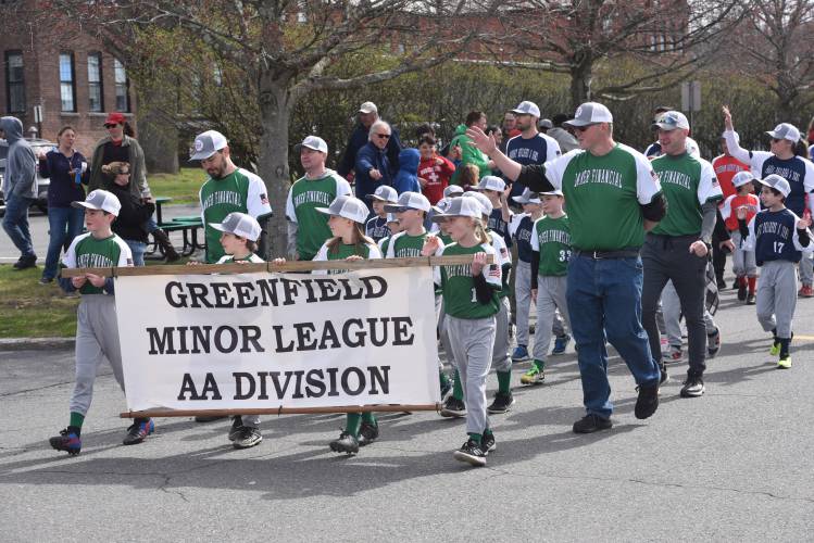Greenfield Minor League baseball players make their way to Lunt Field during its Opening Day parade Sunday. 