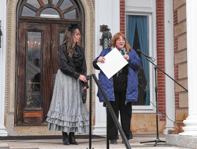 Revival Wheeler Mansion owner Cynthia Butler is given a citation by Rep Susannah Whipps, I-Athol, for her work restoring and opening a bed and breakfast at the historic mansion in Orange.