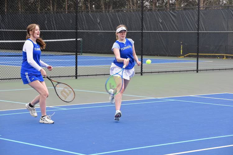 Turners Falls’ Fiona Hutchison returns a volley while teammate Regan Marshall back her up in No. 1 doubles against Frontier on Wednesday in South Deerfield. 