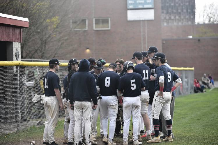 Frontier huddles between innings during a game against Amherst on Wednesday in South Deerfield. 