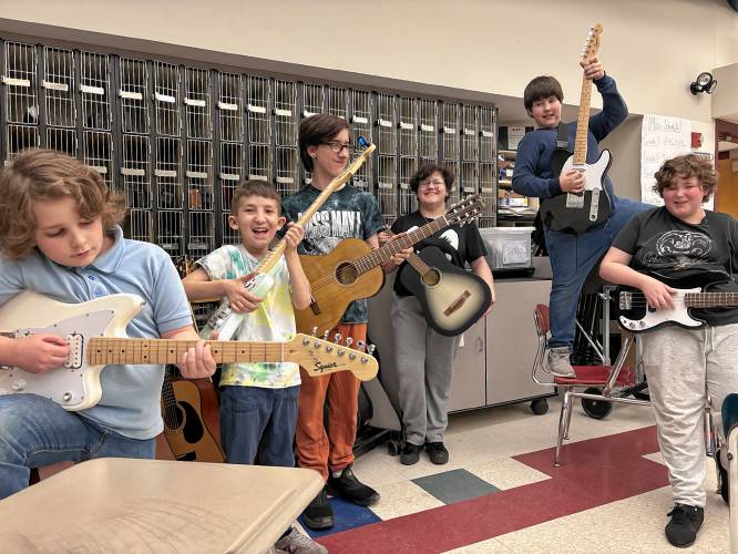 Athol Royalston Middle School’s Guitar Club’s newest members with the club’s new instruments.From left to right: Alec Cravatta, Nathan Bernard, Carden Williams, Sam Oquendo, Aaron Mallette, and Kyle Hemingway.