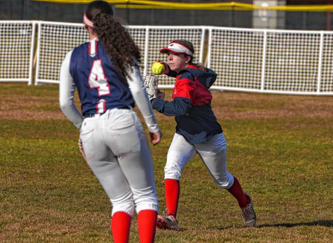 Frontier right fielder Adelaide Ehle gets the ball back in after an Agawam hit during the Redhawks’ season opener on Friday at Zabek Field in South Deerfield.