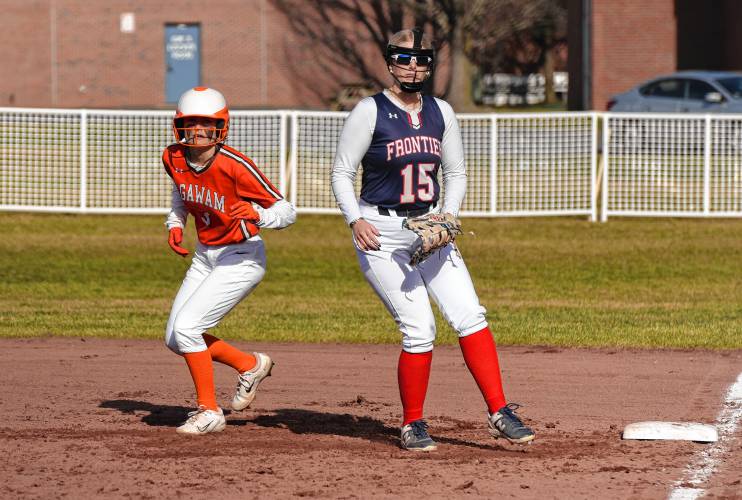 Frontier first baseman Sophia Pinardi (15) guards the bag while Agawam’s Kiley Ryan (4) takes a secondary lead during the Redhawks’ season opener on Friday at Zabek Field in South Deerfield.