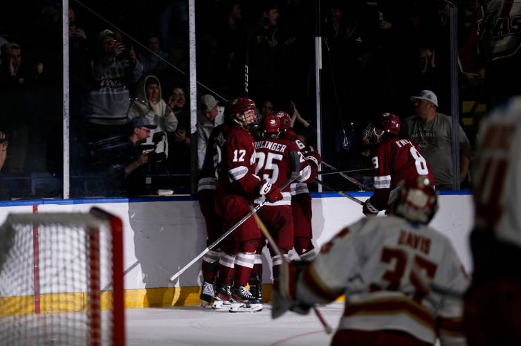 UMass players and fans celebrate after a goal by Liam Gorman (20) against Denver in the second period of the opening round of the NCAA tournament Friday at the MassMutual Center in Springfield.