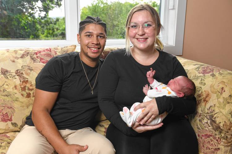 Malik Adams and Carolyn Gilmore of Orange with their baby, Lucia Adams, who was born Aug. 21 in an SUV on Route 2 in Gill.