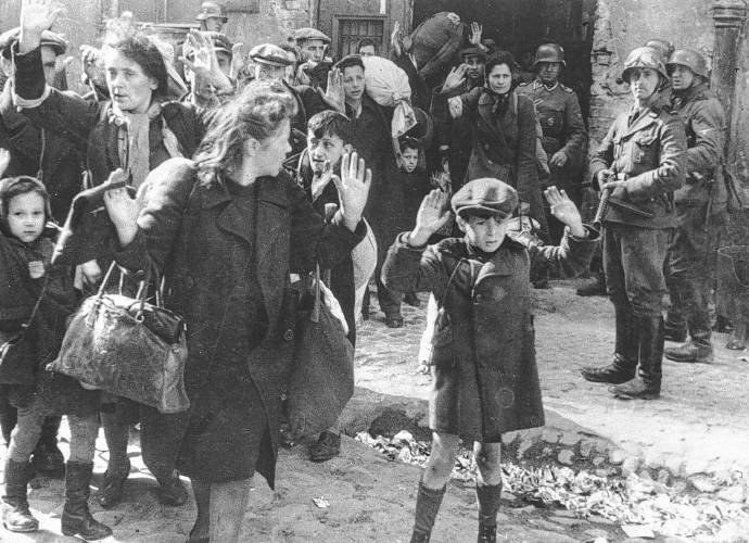 A group of Jews is escorted from the Warsaw Ghetto by German soldiers on April 19, 1943. The picture was used in the 1945 war crimes trials in Nuremberg.