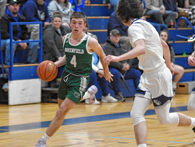 Greenfield’s Caleb Murray (4) drives on Franklin Tech’s Tyler LaFountain during the Green Wave’s 80-45 win on Thursday night in Turners Falls.