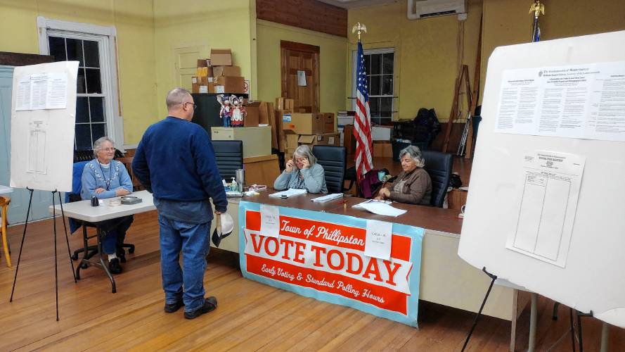 A Phillipston voter checks in with election workers Barbara Sanden, Susan Larabee and Pat Allan during Tuesday's Special State Election.