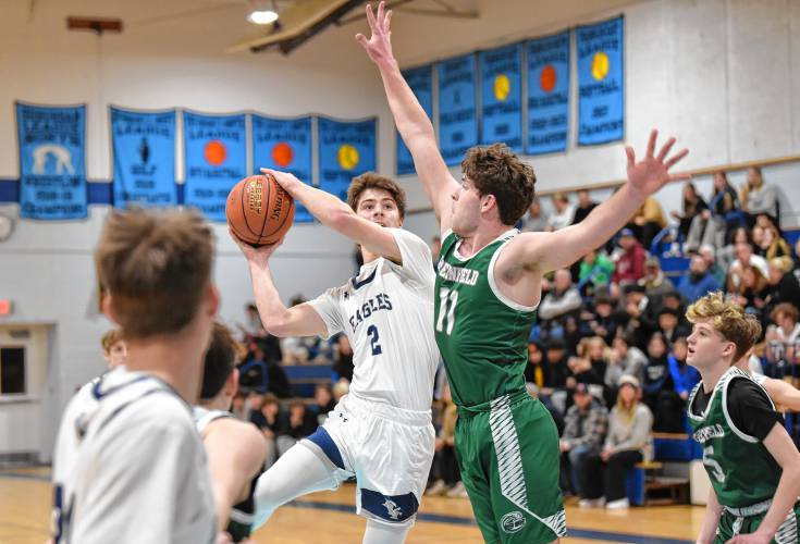 Franklin Tech’s Jack Gancarz looks to shoot while defended by Greenfield’s Jon Breor on Thursday in Turners Falls. 