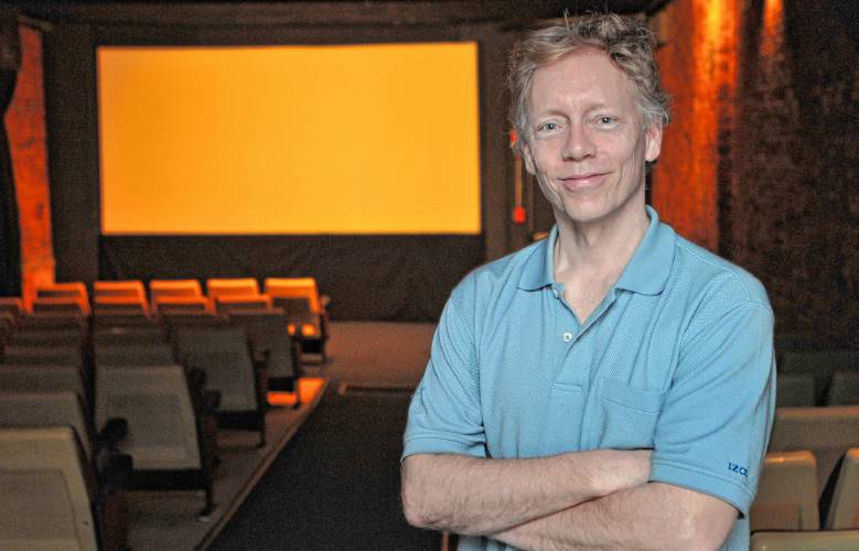 Reporter Steve Pfarrer poses in the former Pleasant Street Theater in Northampton in the late 2010s.