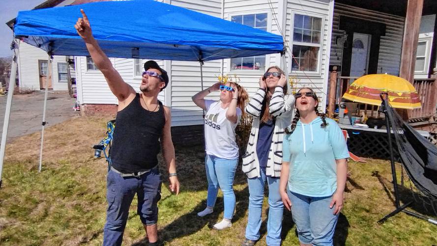 It was a birthday to remember for Laura St. John as she and her friends shared cake and took in Monday’s eclipse from the front yard of their home on Main Street in Athol. (From left) Leo Hamel, Laura St. John, Melissa Hamel and Helen Hamel.