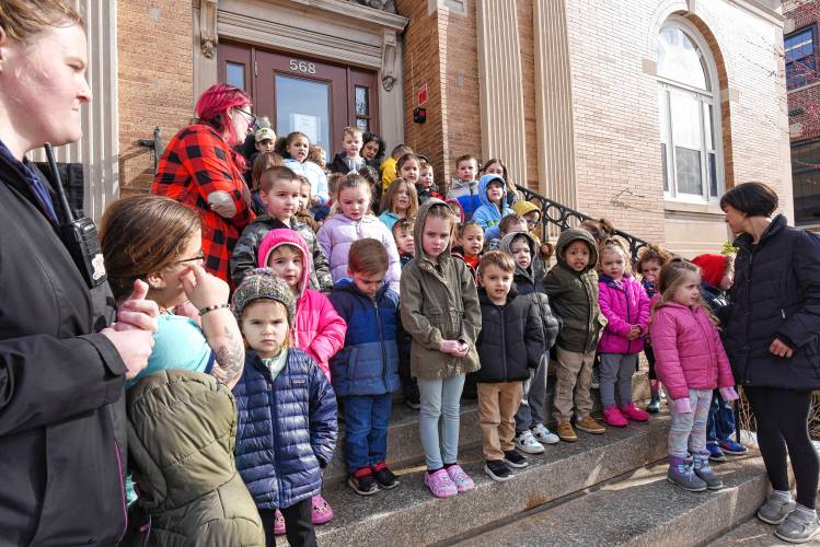 Children from the Athol Area YMCA Preschool sing in front of the Athol Public Library for Child Abuse Prevention Month on Friday morning.