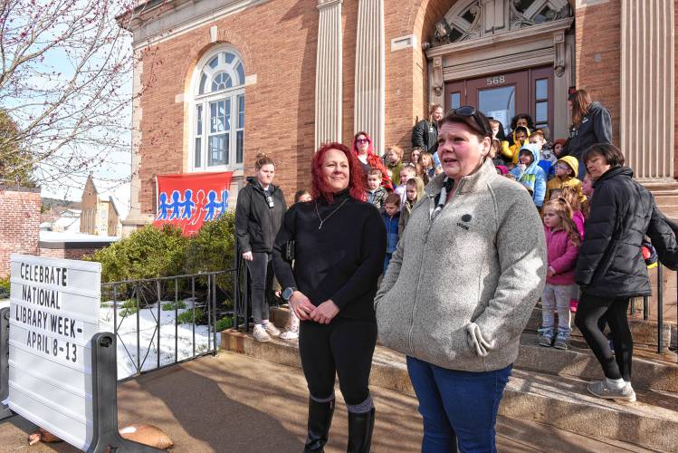 Kena Vescovi of Valuing Our Children and Heather Bialecki-Canning of the North Quabbin Community Coalition speak in front of the Athol Public Library during a flag-raising ceremony for Child Abuse Prevention Month on Friday morning.