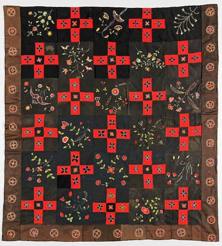 A coverlet made by Rebecca Ayers Mack Heywood, created around 1850. Heywood worked at the textile mills in Winchendon.