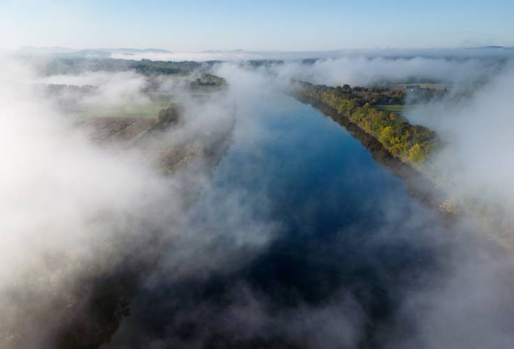 Fog rolls through across the valley over the Connecticut River in the early morning in Sunderland.