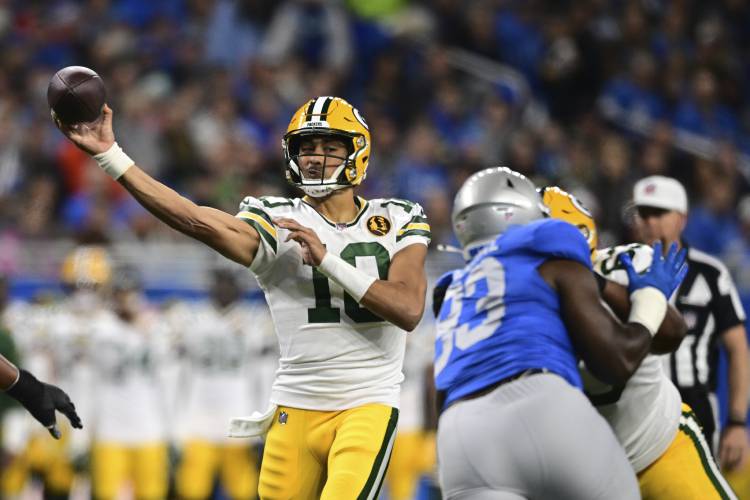 Green Bay Packers quarterback Jordan Love (10) throws during the first half of an NFL football game against the Detroit Lions, Thursday, Nov. 23, 2023, in Detroit. (AP Photo/David Dermer)