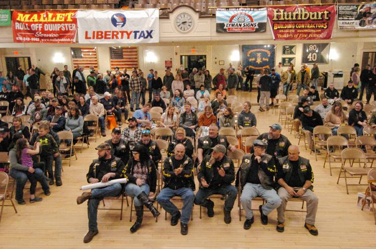 Racers wait to find out their position at the drawing at Athol Town Hall on Friday night before the race.
