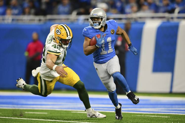 Detroit Lions wide receiver Kalif Raymond (11) rushes during the first half of an NFL football game against the Green Bay Packers, Thursday, Nov. 23, 2023, in Detroit. (AP Photo/David Dermer)