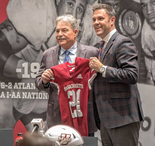 UMass football coach Don Brown, left, and UMass AD Ryan Bamford pose during a press conference at Brown’s introduction in the Martin Jacobson Football Performance Center on Dec. 1, 2021.