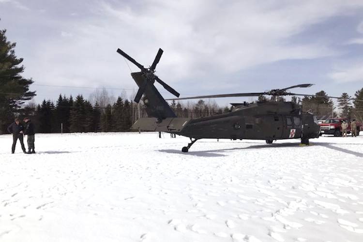 In this U.S. Army photograph by attorney Douglas Desjardins, a damaged Black Hawk helicopter rests on the snow, March 13, 2019, in Worthington. 