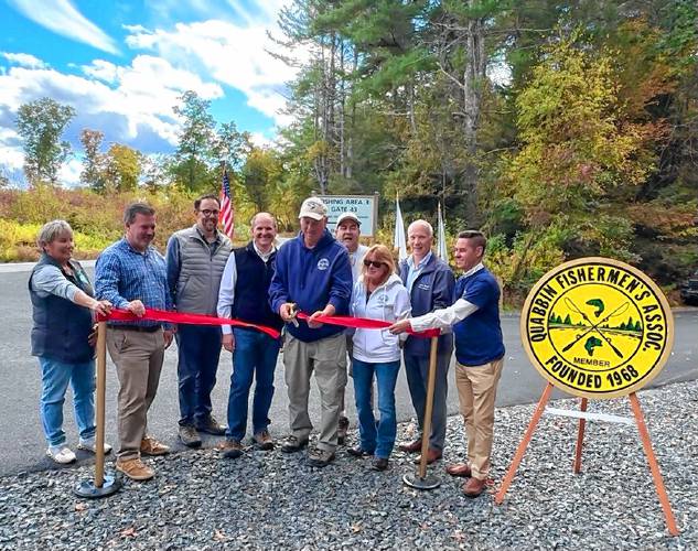 A ribbon-cutting ceremony was held on Tuesday, Oct. 8 for the revamped road. From left to right are Anne Gobi, Massachusetts Director of Rural Affairs, state Rep. Aaron Saunders, DCR Commissioner Brian Arrigo state Rep. Todd Smola, Quabbin Fishermen’s Association President Clayton (Syd) Sydla with other members of the association, state Sen. Peter Durant and state Sen. Jake Oliveira.