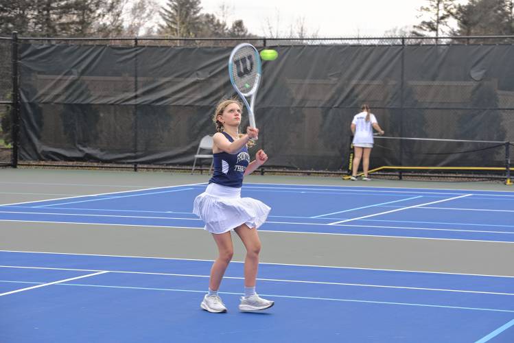 Frontier’s Ella Sibley returns a volley in No. 1 doubles against Turners Falls on Wednesday in South Deerfield. 