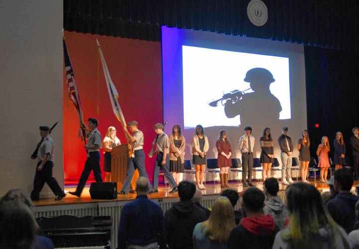 Members of the school’s Army Junior Reserve Officers’ Training Corps retire the colors after a Veterans Day assembly at Ralph C. Mahar Regional School in Orange on Thursday.