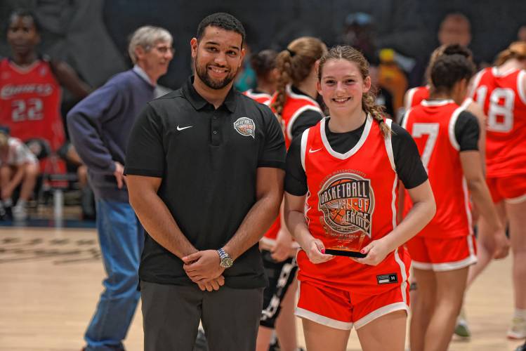 Easthampton’s Kayley Downie poses with the MVP trophy after the Naismith Memorial Basketball Hall of Fame Western Mass. Girls Senior All-Star Game on Thursday night in Springfield.