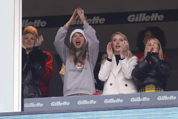 Taylor Swift, center left, reacts with Brittany Mahomes, center right, during the first half of an NFL football game between the Kansas City Chiefs and the New England Patriots, Sunday, Dec. 17, 2023, in Foxborough, Mass. (AP Photo/Charles Krupa)