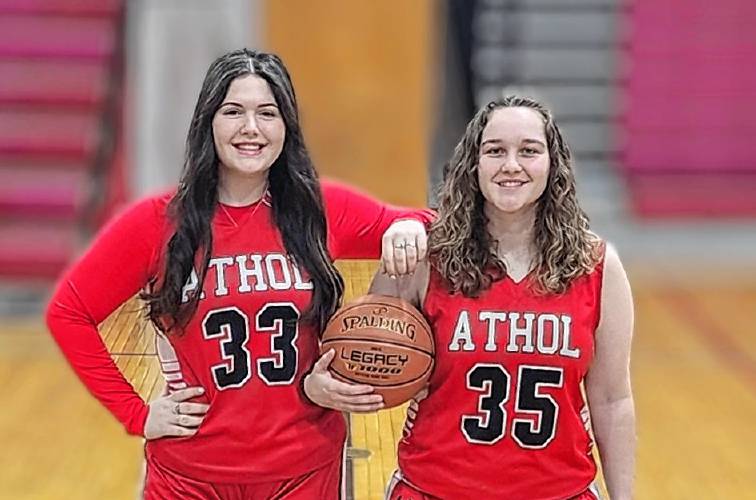 Athol High School seniors Anna Duquette (left) stands with Jenna Bonenfant. The two helped organize next Monday’s “Hoops 4 Hunger” game which will benefit the Athol High School Food Pantry through donations of money and non-perishable food items.