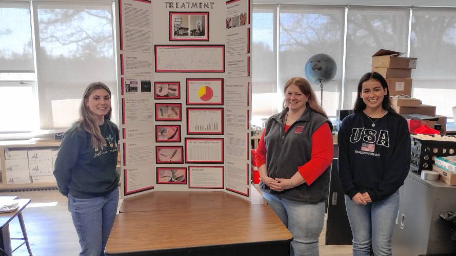 (From left) Athol High School science teacher Emily King with juniors Latasha Sheffield and Allison Robertson. King and Robertson were both recognized at the recent Worcester Regional Science and Engineering Fair. 