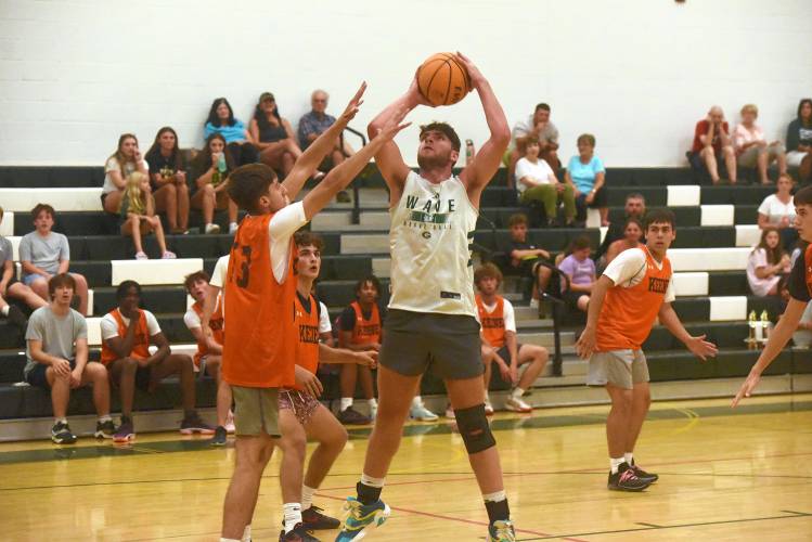 Greenfield's Jon Breor goes up for a shot in the paint against Keene on Wednesday in the boys varsity championship game of the DRIVE League at Greenfield High School. 