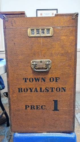 The old ballot deposit box still employed in Royalston’s Town Election recorded that 245 votes had been cast as of 7 p.m. on Monday.