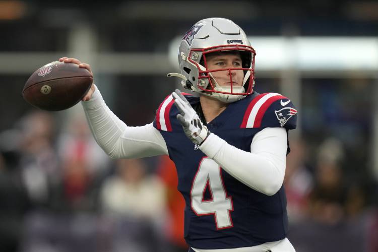 New England Patriots quarterback Bailey Zappe winds up for a pass during the first half of an NFL football game against the Kansas City Chiefs, Sunday, Dec. 17, 2023, in Foxborough, Mass. (AP Photo/Charles Krupa)