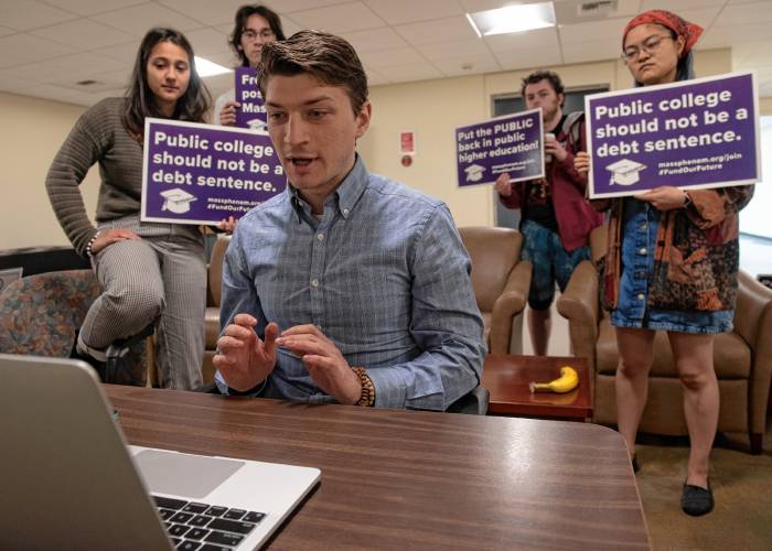 Mark Murdy, a UMass graduate student, speaks at the board of trustees’ virtual meeting Wednesday to oppose tuition and fee hikes going into effect this fall with Ella Prabhakar, left, a member PHENOM, Public Higher Education Network of Mass., and other UMass students. 