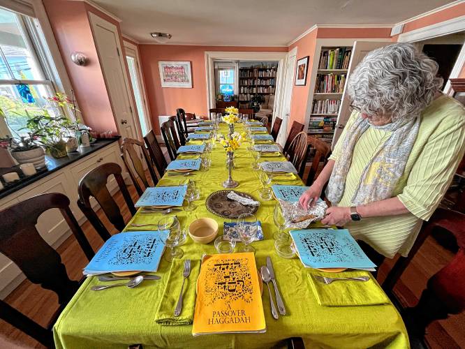 The Goldstein family Passover Seder setup. In our Haggadah, many of the ordinary patriarchal details and textual antiquities are crossed out and replaced with hand-scrawled phrases like “peace and love to all people of all backgrounds and races, everywhere on Earth.” God does not use he/him pronouns in our Haggadah.