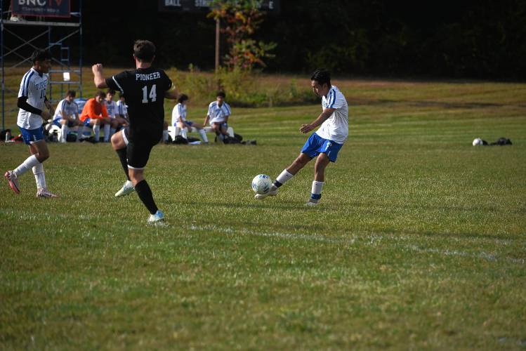 Turners Falls' Yolvin Ovalle-Mejia takes a shot while Pioneer's Braeden Tsipenyuk tries to get in the way in Northfield Monday. 