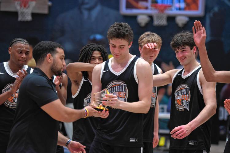 Northampton’s Silas Coles accepts the MVP trophy following the Naismith Memorial Basketball Hall of Fame Western Mass. Class A and B Senior All-Star Game on Thursday night in Springfield.