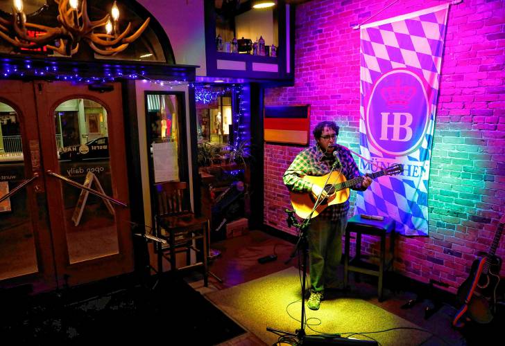 Matt Emmer performs during open mic night at Wurst Haus in Northampton. He’ll sometimes play three open mics a week in the region.