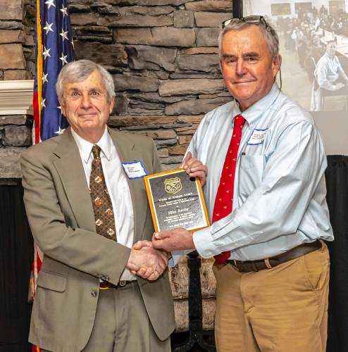 Mike Roche (left) receives the Words of Wisdom Award from Bill Davis, vice president of the Worcester County League of Sportsmen's Clubs at its annual banquet on March 23.