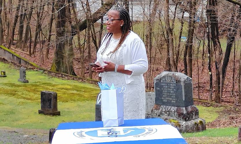 Teri Jackson Wright, northeast regional director of the National Alumnae Association of Spelman College, welcomes alumnae and visitors to Saturday's Founders Day celebration at Silver Lake Cemetery.
