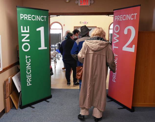 People file in to vote at 62 Cheney St. in Orange on Monday. 