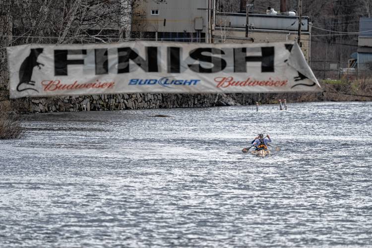 Canoe No. 3, paddled by Ryan Zaveral and Shane MacDowell, was the first to cross the finish line in the River Rat Race.