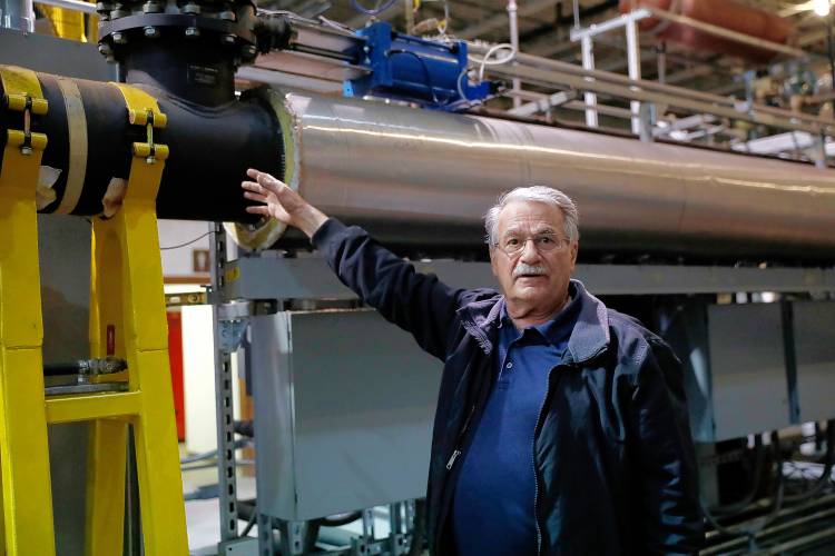 Michael Garjian explains the processes of his patented CarbonStar Catalytic Vacuum Pyrolysis System on Tuesday afternoon in Holyoke. The CarbonStar process converts any form of biomass into biochar using a catalytic vacuum pyrolysis in which temperature, residence time, and vacuum levels are precisely controlled by computer.