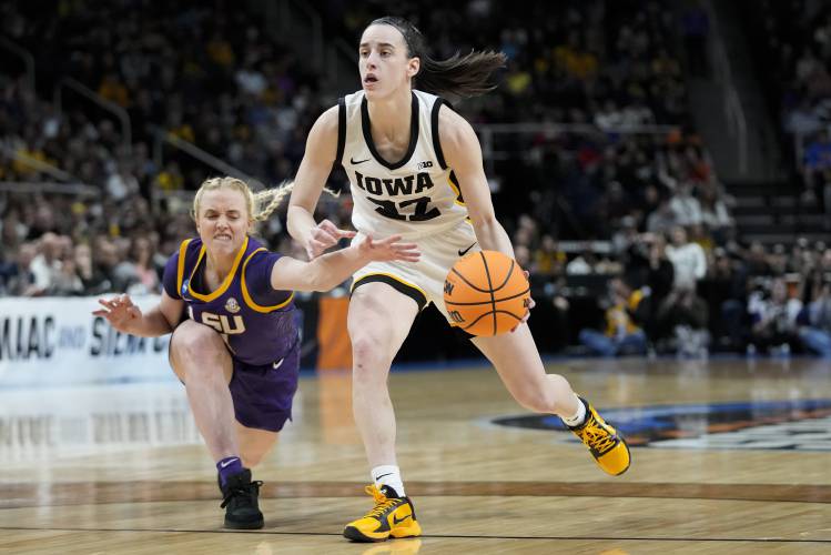 LSU guard Hailey Van Lith (11) tries to strip the ball from Iowa guard Caitlin Clark (22) during the second quarter of an Elite Eight round college basketball game during the NCAA Tournament, Monday, April 1, 2024, in Albany, N.Y. (AP Photo/Mary Altaffer)