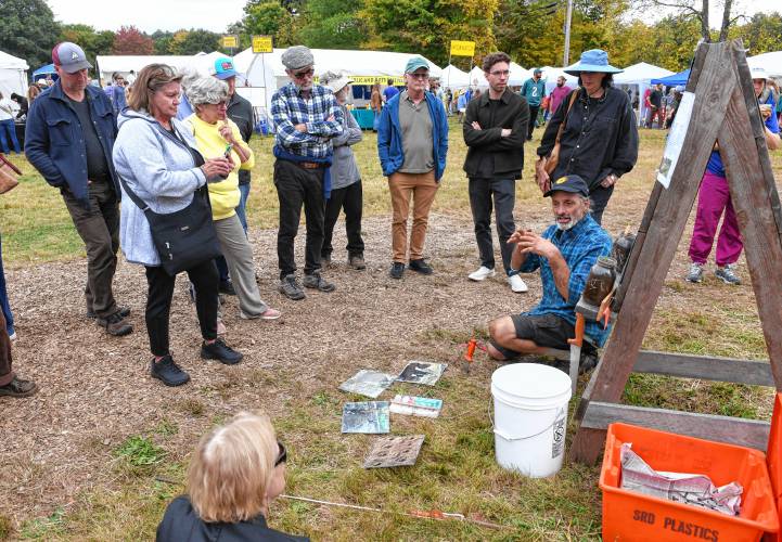 Ricky Baruc of the Seeds of Solidarity Farm leads a garlic-growing seminar at the North Quabbin Garlic and Arts Festival in Orange on Sunday afternoon.